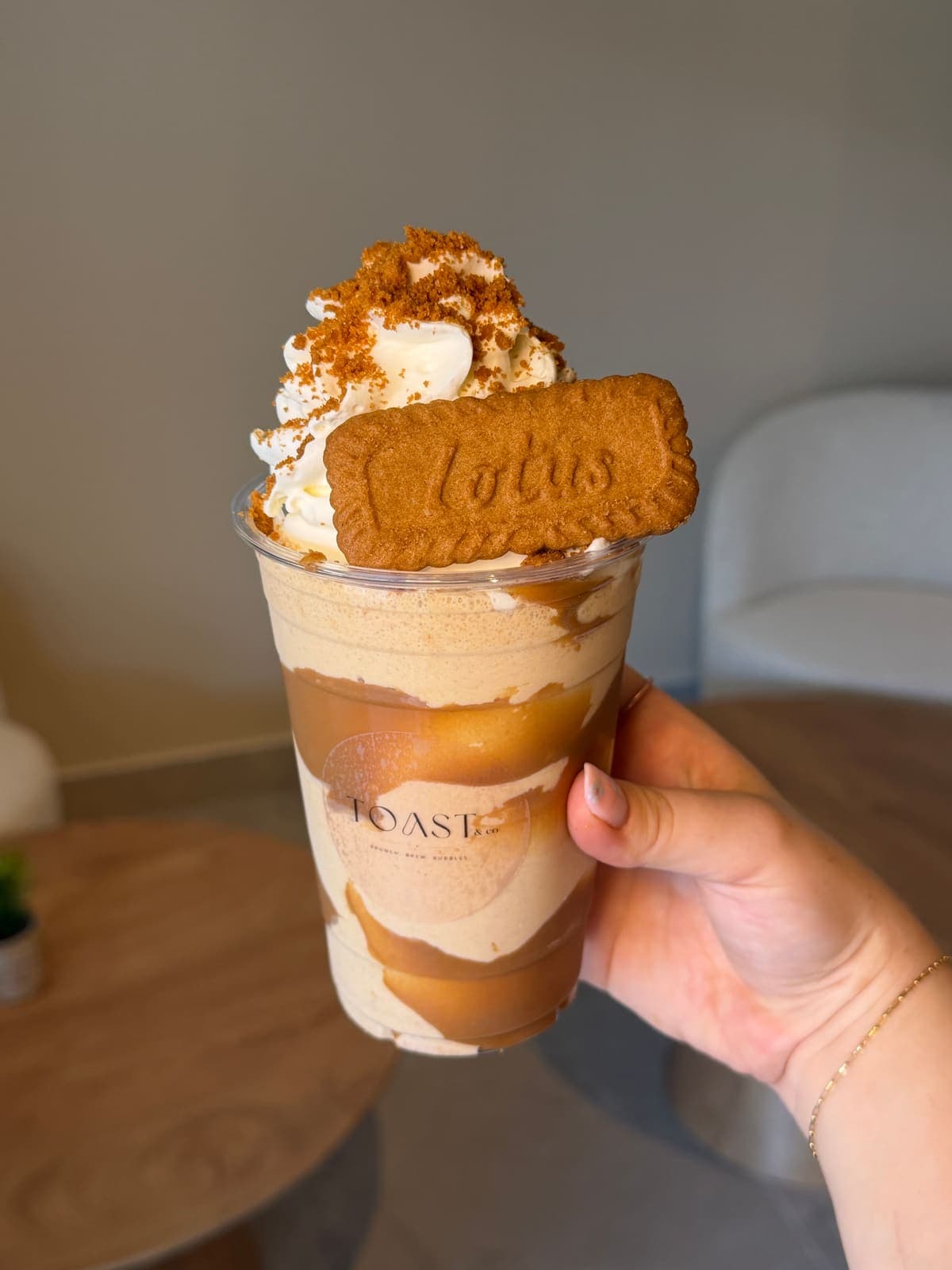 Biscoff milkshake topped with whipped cream and a Lotus biscuit at TOAST & Co Derby