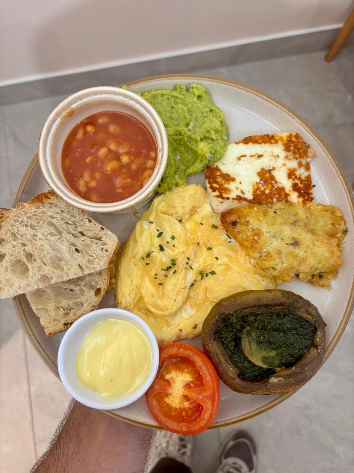 Garden Breakfast at TOAST & Co with grilled halloumi, smashed avocado, eggs your way, hashed potato, baked beans and artisan sourdough