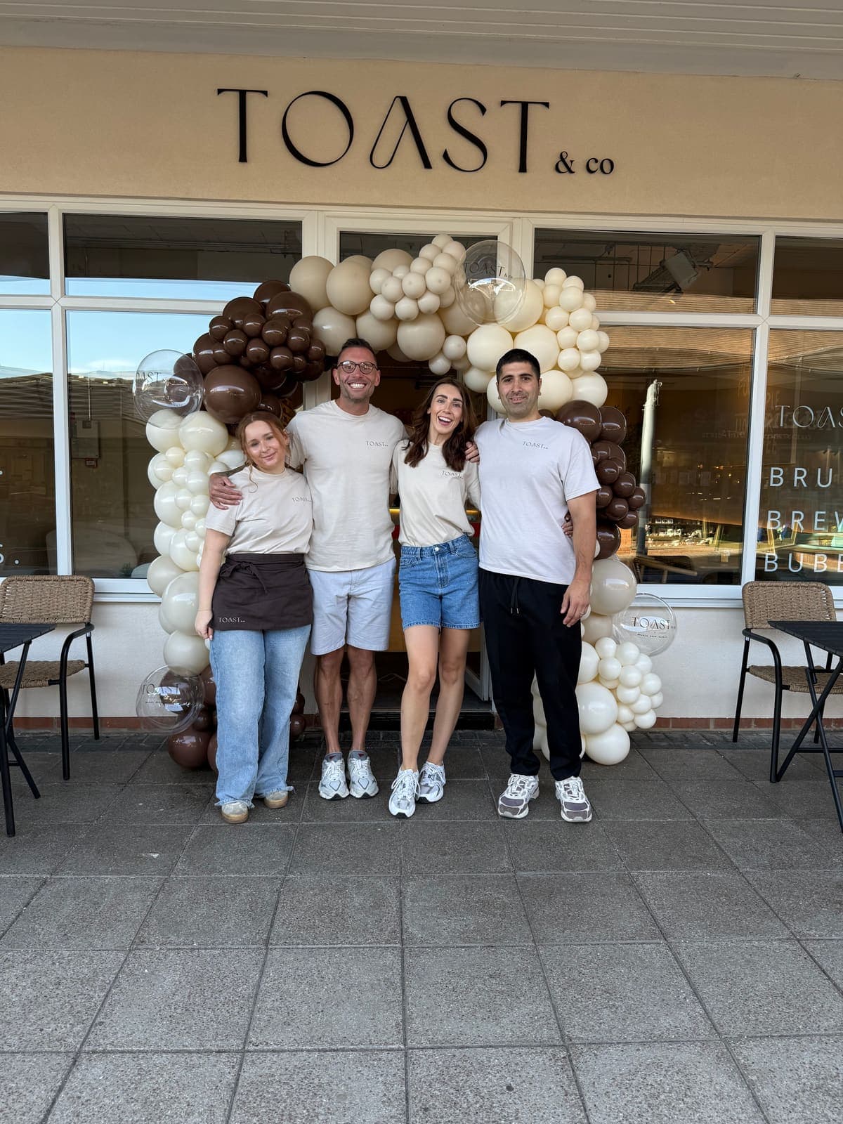 The TOAST & Co team outside the Allestree café on opening day with a balloon display